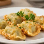 Ravioles croustillantes cuites à l'airfryer, parfaites pour une entrée délicieuse et légère.